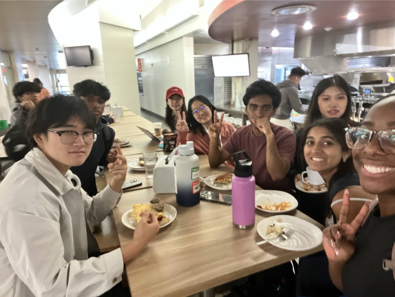 Friends around a dining hall table